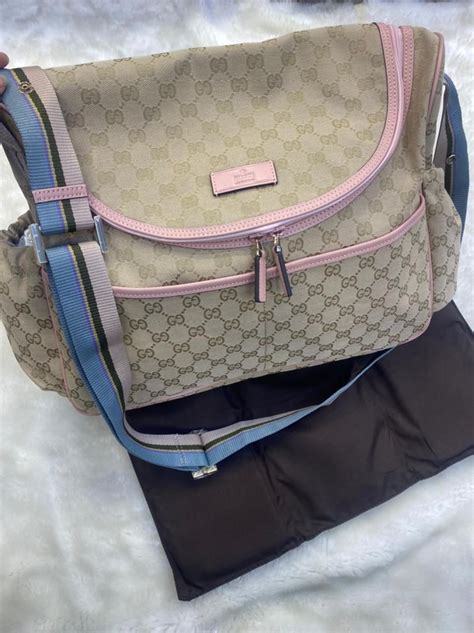 bolsa maternidade gucci farfetch